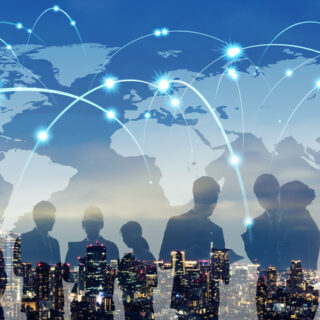 Artistic rendering of a map with the shadow of people collaborating overlaying it.